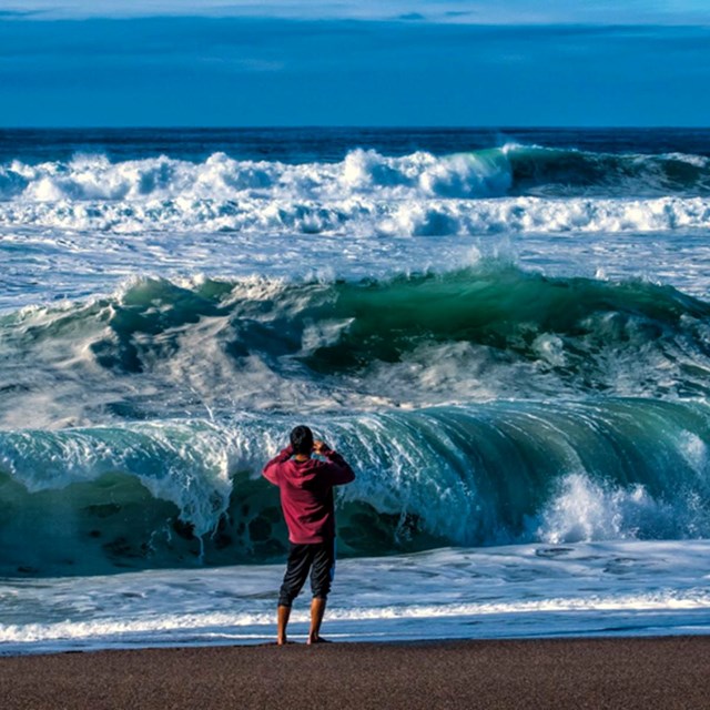 man faces crashing waves