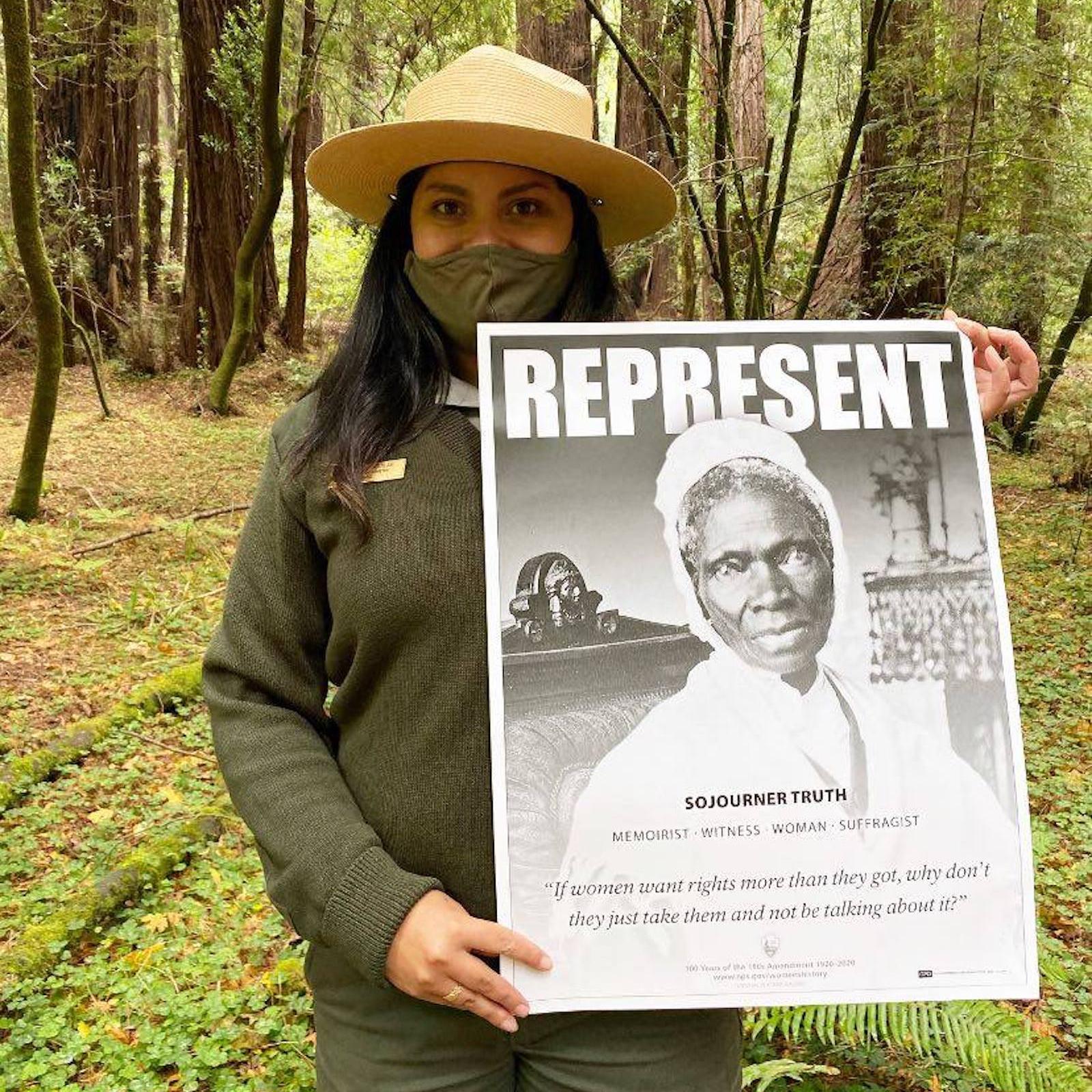 Ranger holds photo of ida b wells