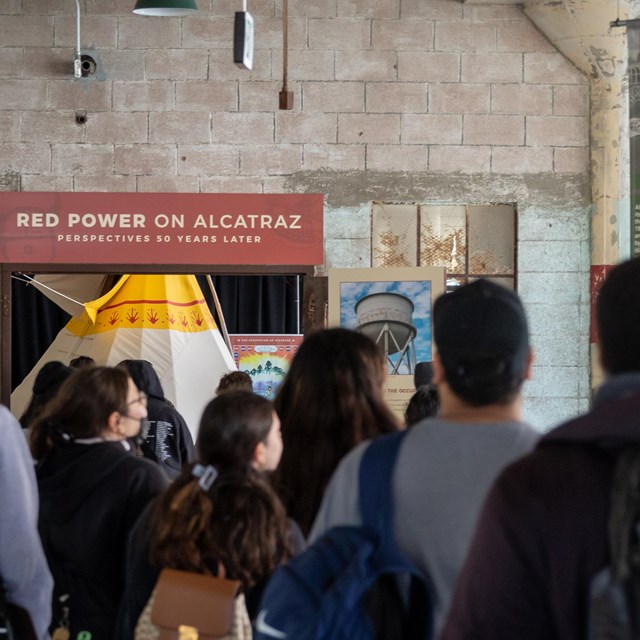 Students walk towards the Red Power Exhibit on Alcatraz Island