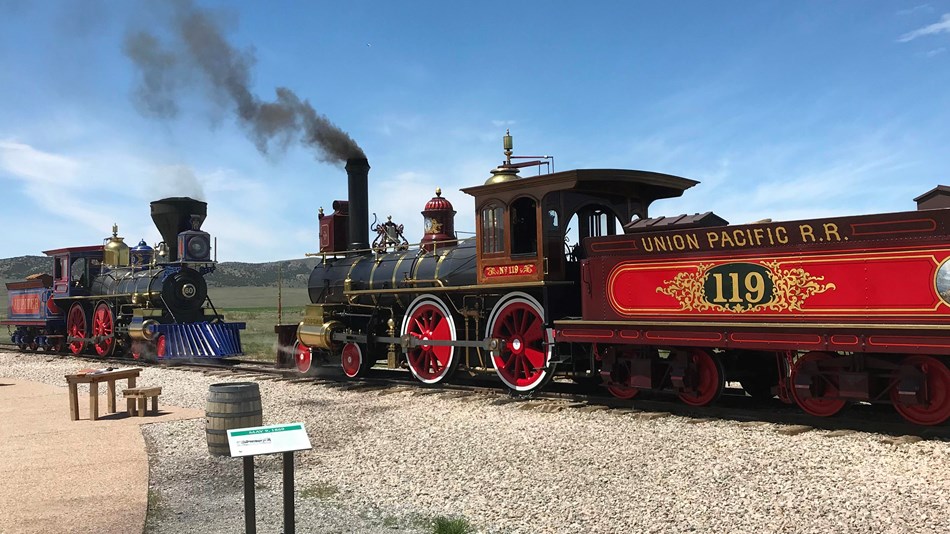 Two locomotives face each other at the last spike site.