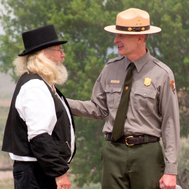 Park Ranger and re-enactors in from of #119 