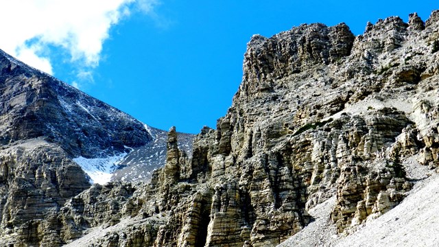 Tan cliff with glacier till at the bottom
