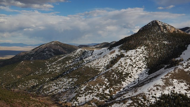 Mountain ridge partly covered in snow