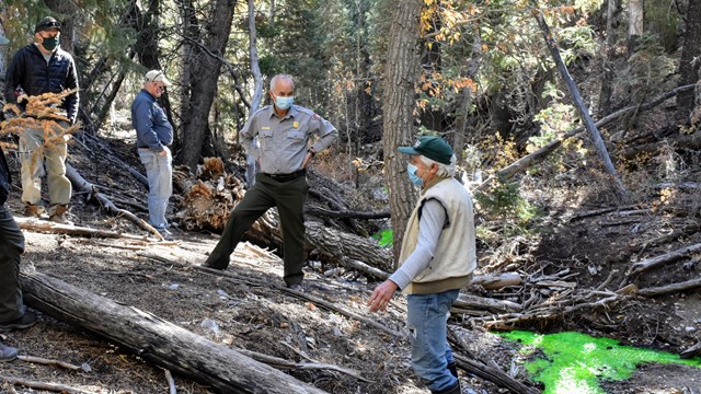 Park superintendent talking with water researchers.