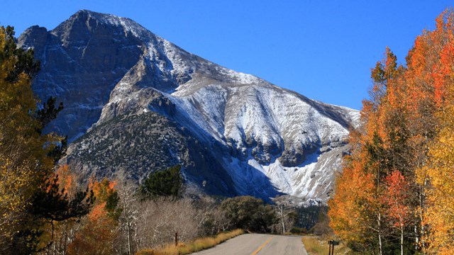 Wheeler Peak towers over the scenic roadway in fall.