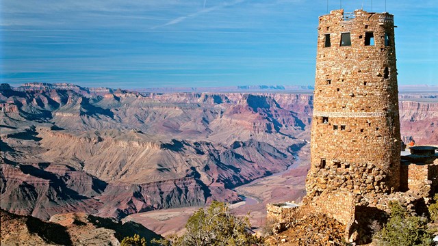 A stone tower on the edge of the Grand Canyon.