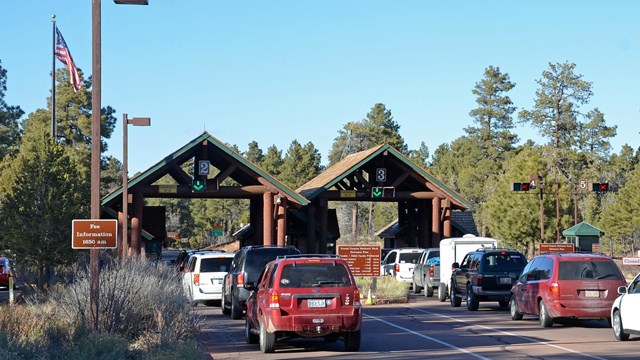 2 lines of cars waiting to enter the park at the entrance station.
