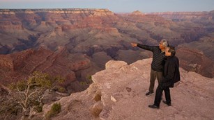 Cellist YoYoMa stands near the canyon with tribal member, Jim Enote 