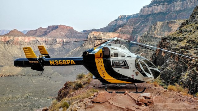 A park helicopter waits near switchbacks on the South Kaibab Trail to assist an injured hiker. 