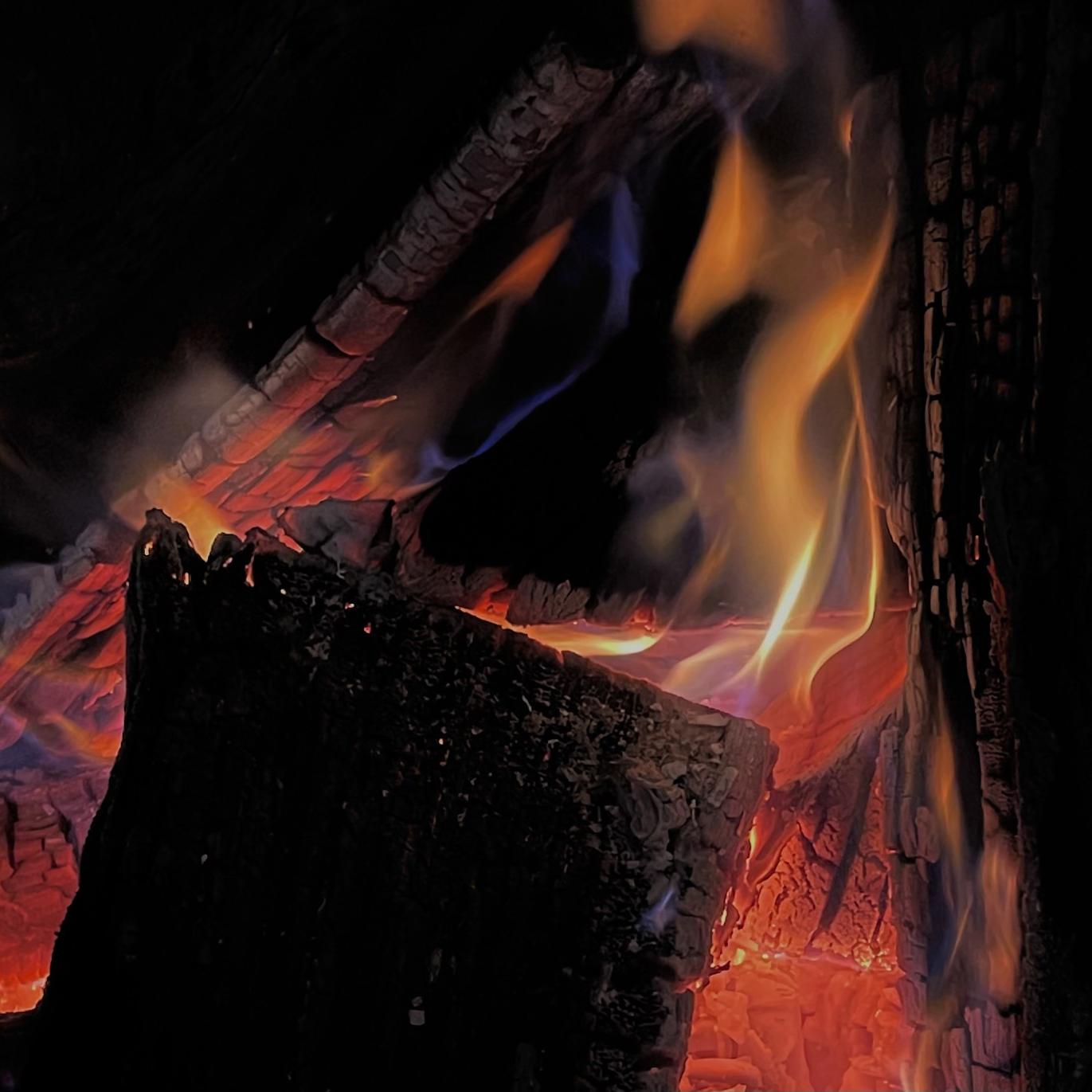 A group of logs burning.