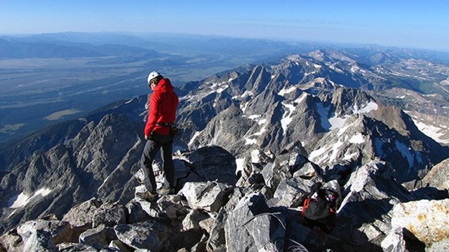 A climber in high, rocky terrain