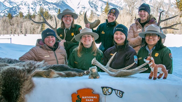 Rangers Behind Snow Desk