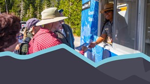 Ranger with visitors at mobile contact station.