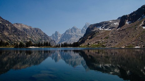 Mountains reflected in an alpine lake.