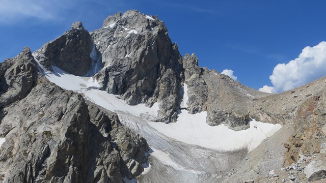 Middle Teton glacier on the northeast of peak. Previous snow looks white, glaciers look gray.