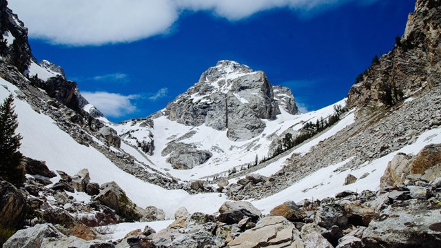 A mountain peak between two canyon walls.