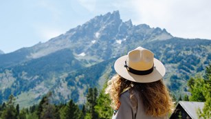 Ranger looks towards the Teton Range.