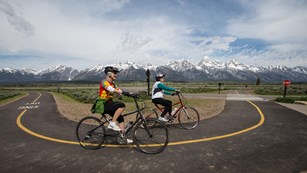 Bikers biking along the multi-use pathway