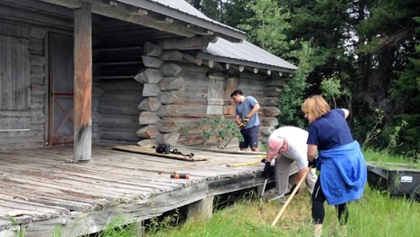 Hammer Corps volunteers work on a historic structure