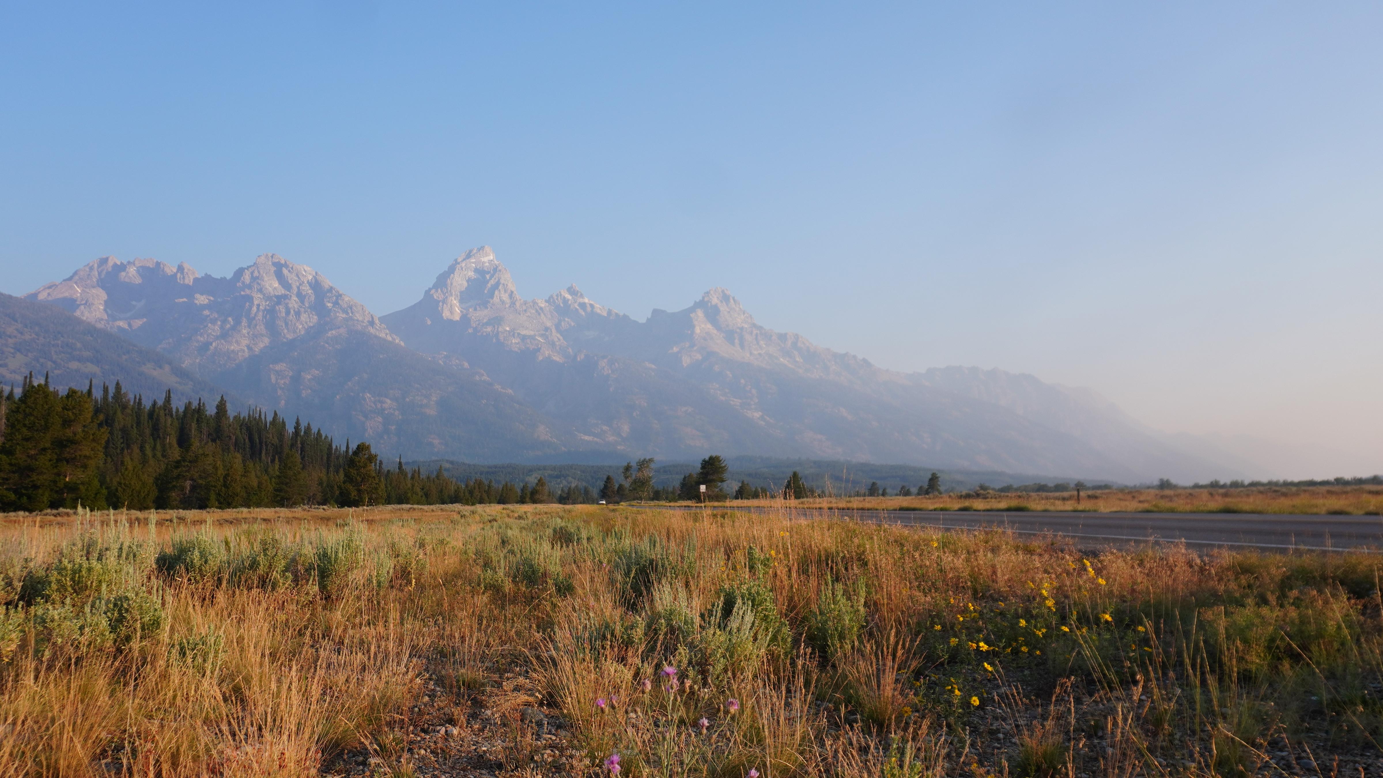 Low-lying smoke obscuring the mountain range.