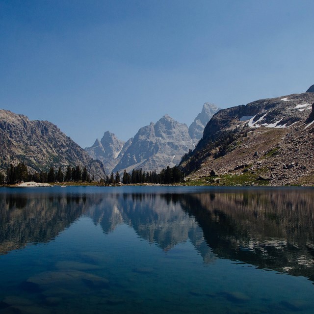 Mountains reflected in an alpine lake.