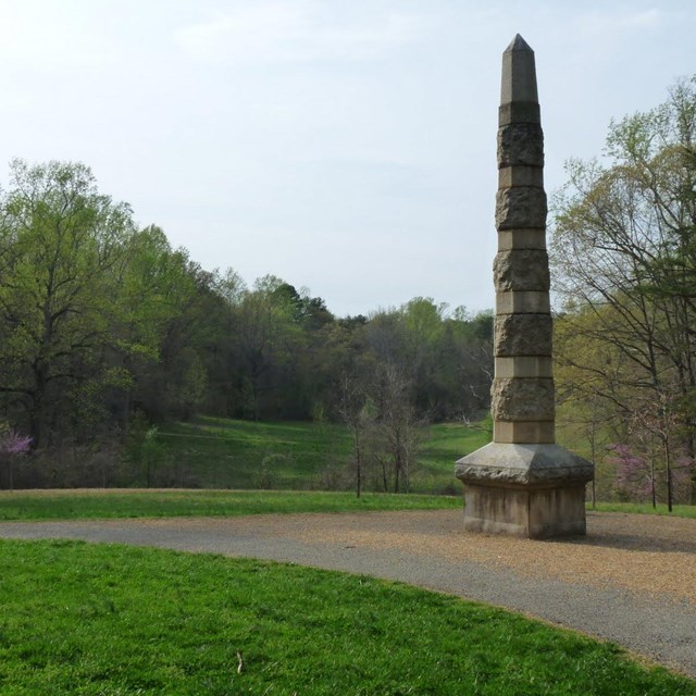 Image of the Calvary Monument made of stone and shaped as pillar