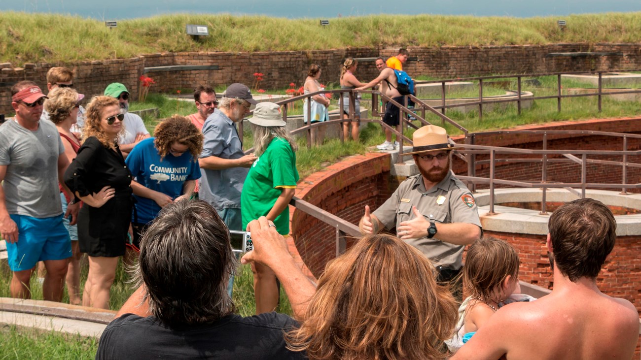 A ranger talks to visitors about park resources