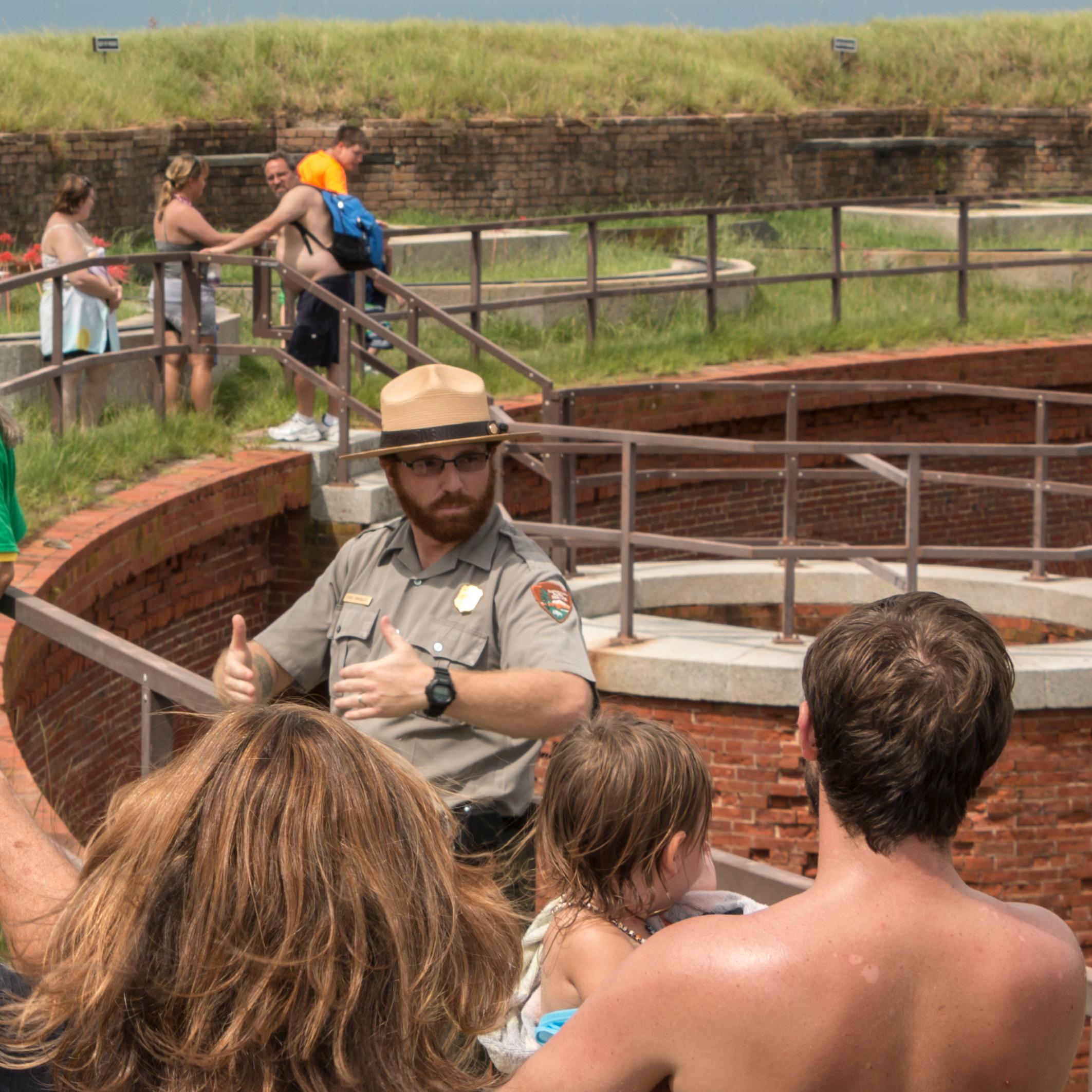 A ranger talks to visitors about park resources