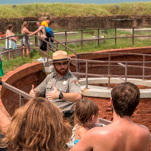 A ranger talks to visitors about park resources