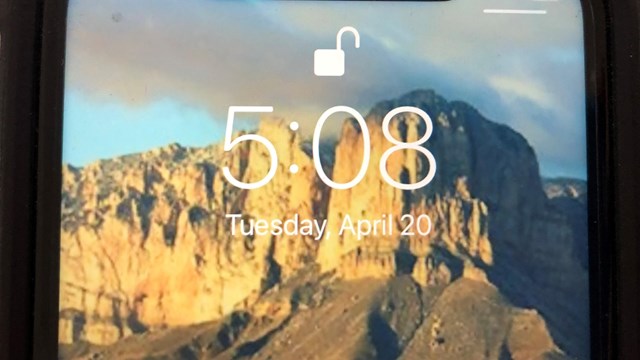 Lock screen of a smart phone showing the time