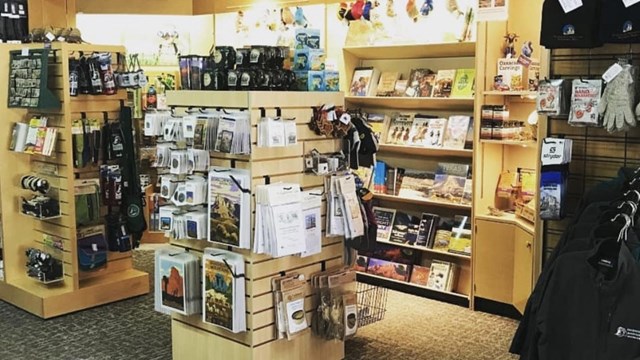 A picture of the park store lit up. Books, posters and other knick knacks are on display. 