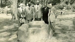 Five men gathered around at a memorial stone at the 1953 dedication of the park.