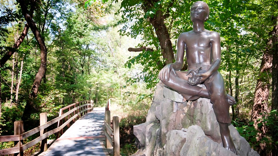 Boy Carver Statue, sculpted by Robert Amendola in 1960.