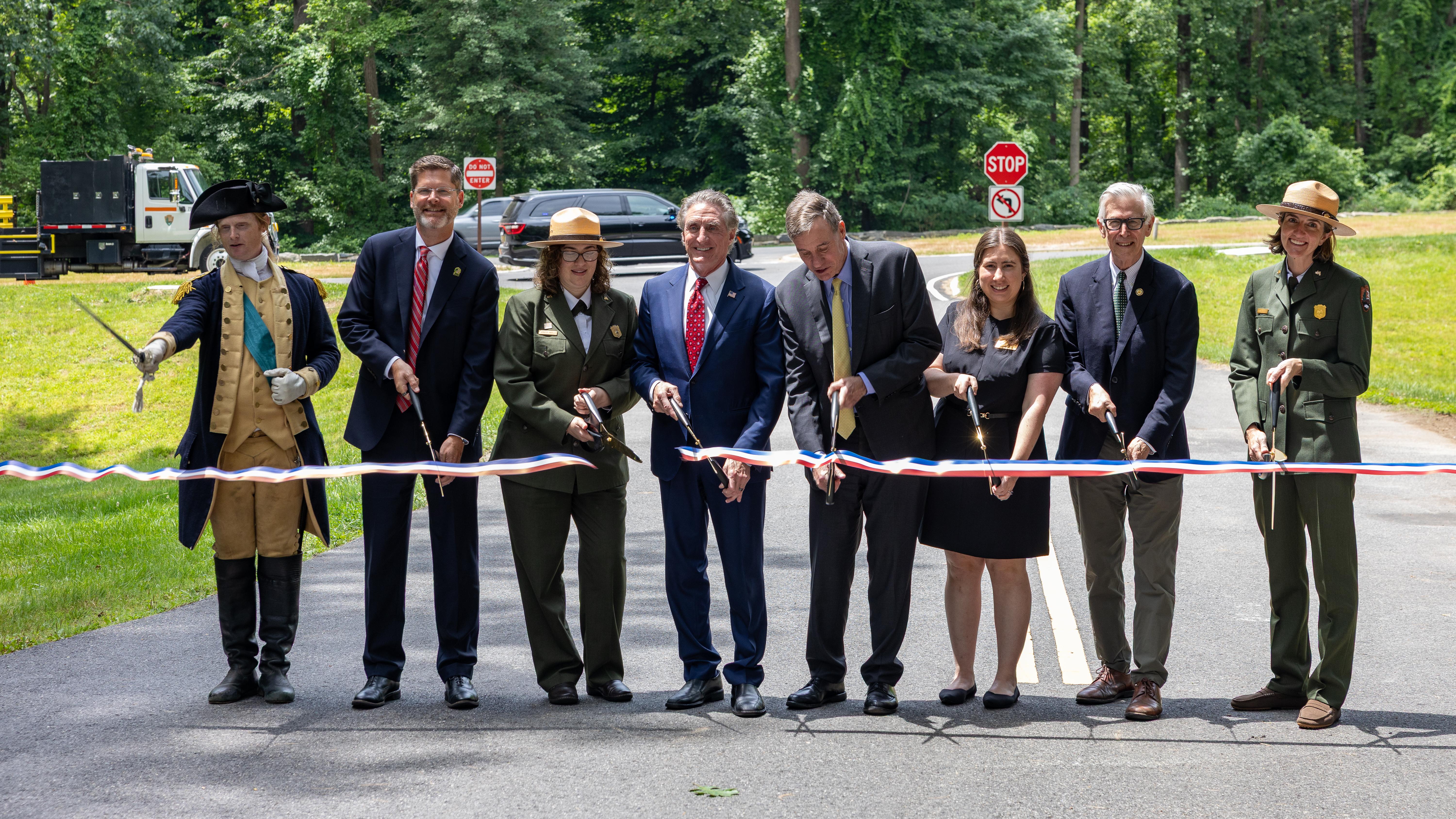Officials cut a ribbon