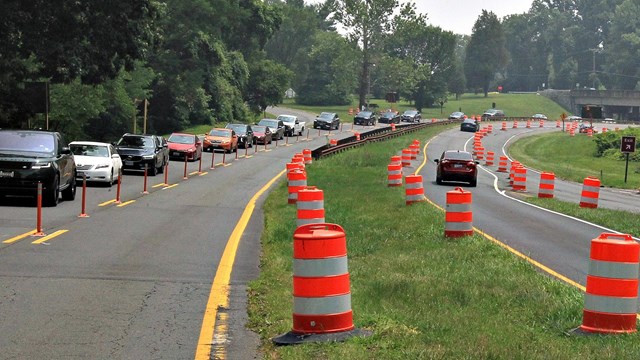 A parkway with cars driving on it.