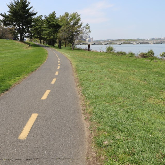 A paved path next to the river.