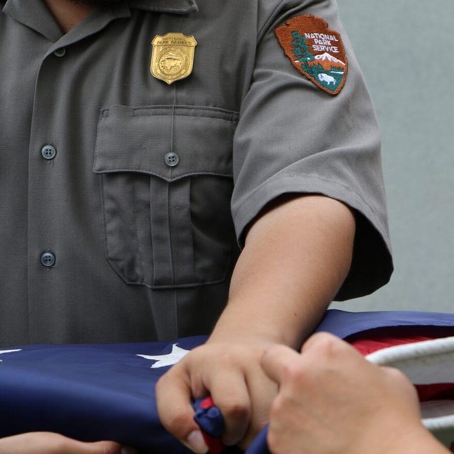 Ranger folding a flag