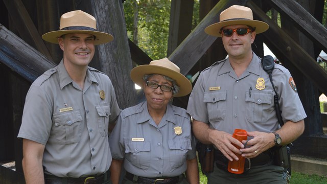 three park rangers smiling for the camera