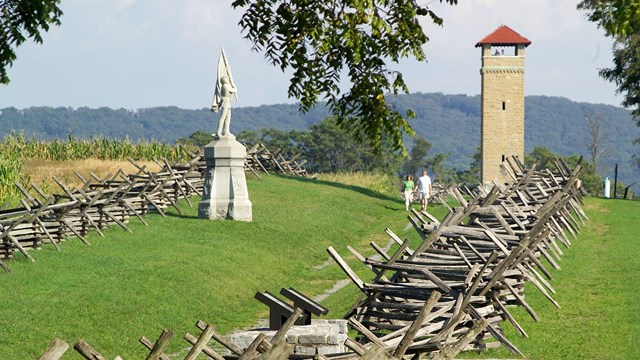 at Antietam; worm-fence-lined path known as Bloody Lane; showing a statue and the observation tower