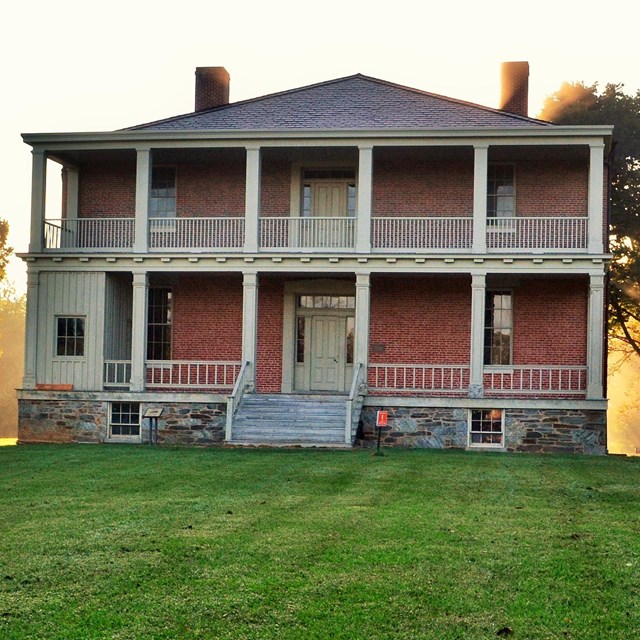 Two story brick structure with double porches