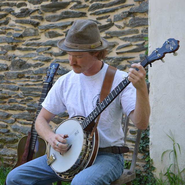 photograph of Tim Lancaster playing a banjo