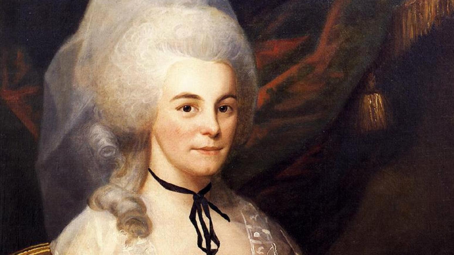 Elizabeth Schuyler Hamilton painting; she sits in a silver dress with a large white hairstyle.