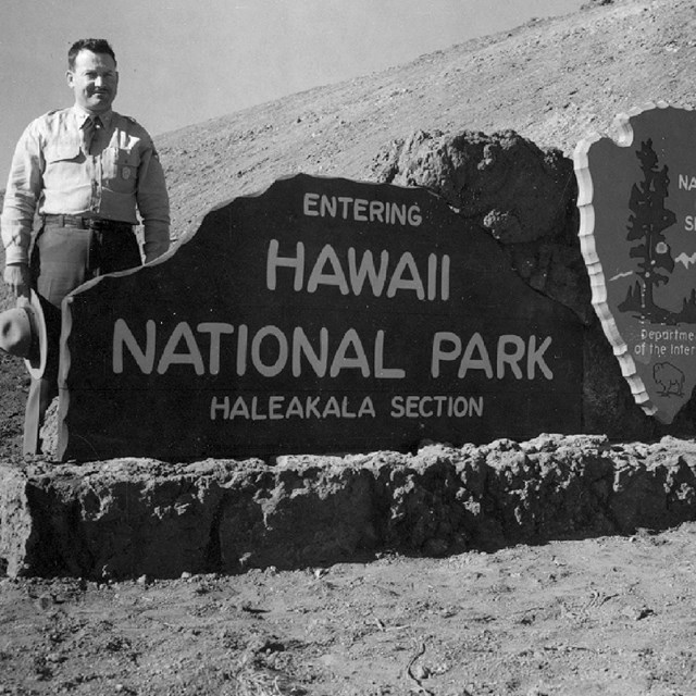 Rangers at park entrance sign