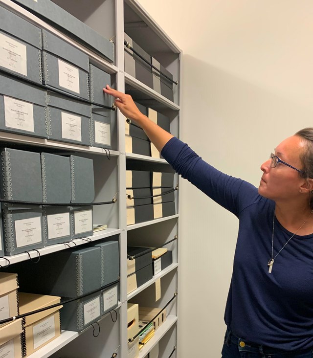 women looking at shelves full of boxes