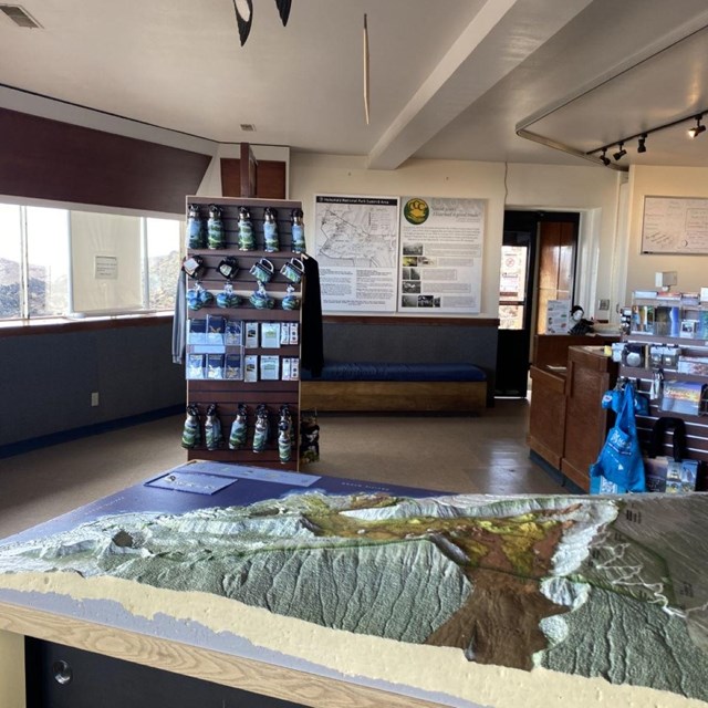The interior of a visitor center featuring a 3D model of a mountain