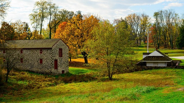 Hampton's granary and dairy with fall foliage. 