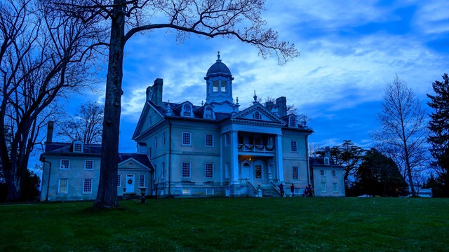 A picture of Hampton Hall exterior in early winter evening