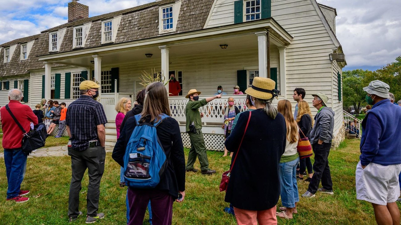 A ranger giving a talk to visitors at the farm side of the park.