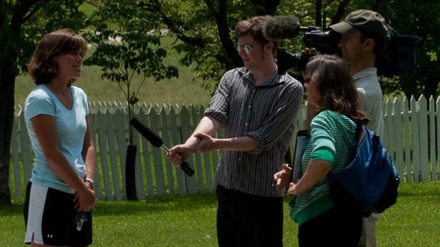 Visitors filming in the park.