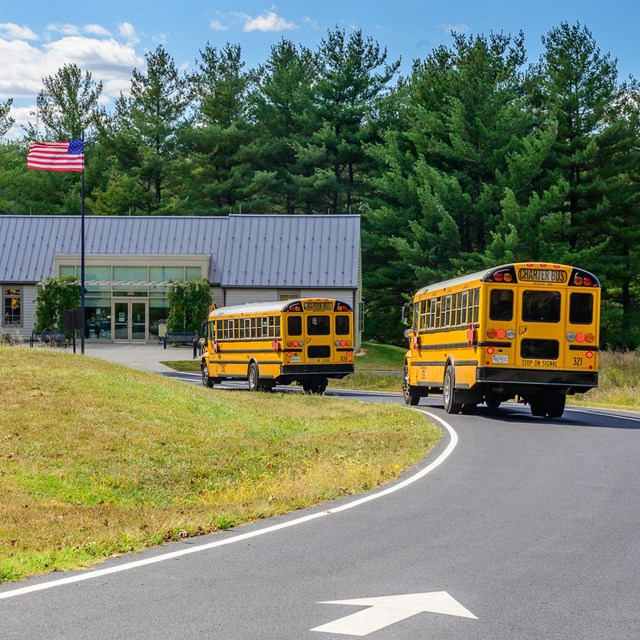 School buses pulling up in front of the Hampton Visitor Center